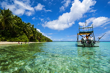 Little motor boat in the turquoise waters of the Ant Atoll, Pohnpei, Micronesia, Pacific