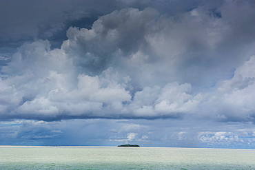 Dramatic sky over a little island in the Rock islands, Palau, Central Pacific, Pacific