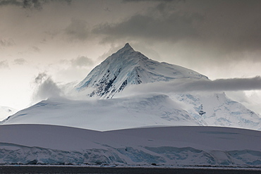 Dark clouds over the mountains and glaciers of Port Lockroy research station, Antarctica, Polar Regions