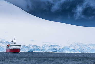 Cruise ship in the glaciers and icebergs, Port Lockroy research station, Antarctica, Polar Regions