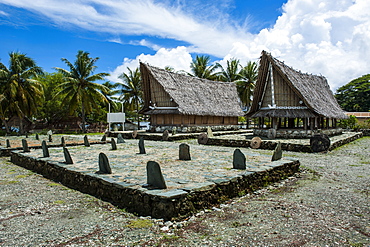 Traditional house with stone money in front, Island of Yap, Federated States of Micronesia, Caroline Islands, Pacific 