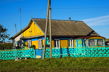 Traditional brightly painted house in the UNESCO World Heritage Site Castle Nesvizh, Belarus, Europe