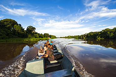 Tourists on a boat searching for animals in the Pantanal, UNESCO World Heritage Site, Brazil, South America