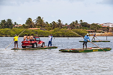 People with sand buggies crossing a river north of Natal, Rio Grande do Norte, Brazil, South America