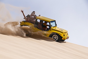 Riding down the sand with sand buggies in Natal, Rio Grande do Norte, Brazil, South America