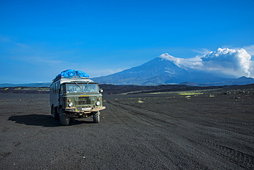 Russian truck stops at a viewpoint over the lava sand field of the Tolbachik volcano, Kamchatka, Russia, Eurasia