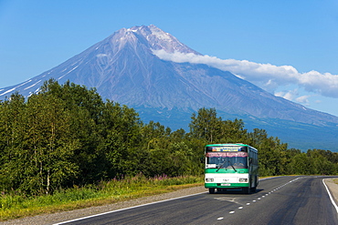 Public bus in front of the Avachinskaya Sopka volcano near Petropavlovsk-Kamchatsky, Kamchatka, Russia, Eurasia