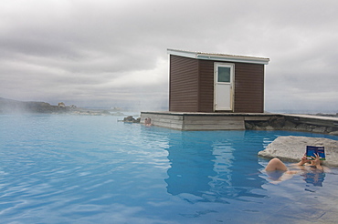 Young woman enjoying bathing in hot spring, Myvatn, Iceland, Polar Regions