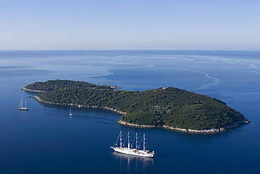 Yacht sailing round the island of Lokrum, part of the Elaphite Islands, near Dubrovnik, Croatia, Europe