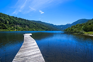 Wooden boat pier on Lago Tinquilco in the Huerquehue, southern Chile