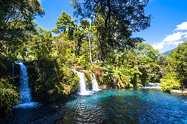 Ojos del Calburga waterfalls near Pucon, southern Chile, South America 