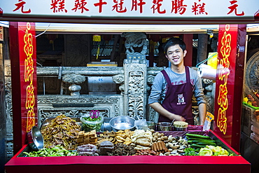 Young man in a food stall, Shilin Night Market, Taipei, Taiwan, Asia