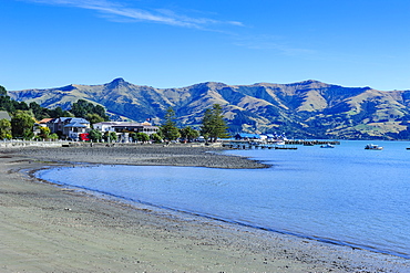 Sandy beach in Akaroa harbour, Banks Peninsula, Canterbury, South Island, New Zealand, Pacific