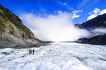 Tourist hiking on Fox Glacier, Westland Tai Poutini National Park, South Island, New Zealand, Pacific