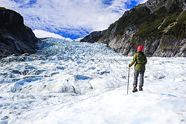 Woman standing on the ice of Fox Glacier, Westland Tai Poutini National Park, South Island, New Zealand, Pacific