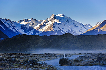 Road in Mount Cook National Park with illuminated mountains in the background, UNESCO World Heritage Site, South Island, New Zealand, Pacific