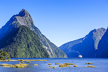 Cruise ship passing through Milford Sound, Fiordland National Park, UNESCO World Heritage Site, South Island, New Zealand, Pacific