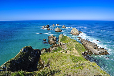 View from the Nugget Point Lighthouse in the turquoise waters with huge rocks, the Catlins, South Island, New Zealand, Pacific