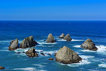 View from the Nugget Point Lighthouse in the turquoise waters with huge rocks, the Catlins, South Island, New Zealand, Pacific