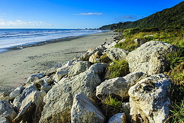 Huge rocks on a sandy beach on the wild west coast of South Island between Greymouth and Westport, West Coast, South Island, New Zealand, Pacific