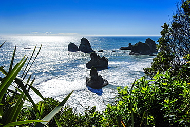 Rocky outcrops in the ocean along the road between Greymouth and Westport, West Coast, South Island, New Zealand, Pacific