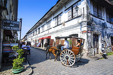 Horse cart riding through the Spanish colonial architecture in Vigan, UNESCO World Heritage Site, Northern Luzon, Philippines, Southeast Asia, Asia