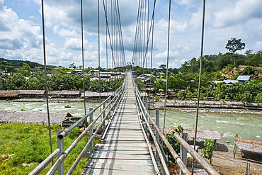 Huge hanging bridge spanning above the Bohorok river, Bukit Lawang, Sumatra, Indonesia, Southeast Asia, Asia