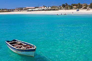 Rowboat in blue sea off coast, Santa Maria, Sal, Cape Verde Islands, Atlantic, Africa