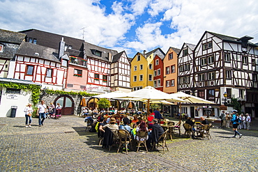 Restaurant in front of half timbered houses in Bernkastel-Kues, Moselle valley, Rhineland-Palatinate, Germany, Europe