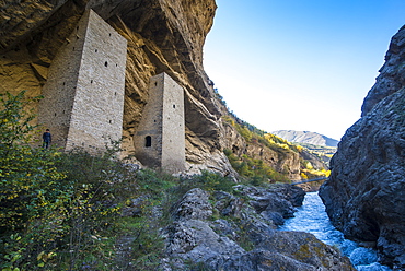 Chechen watchtowers in an overhanging cliff on the Argun River, near Irum Kale. Chechnya, Caucasus, Russia, Europe