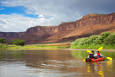 Couple kayaking  down the Colorado River, Castle Valley near Moab, Utah, United States of America, North America