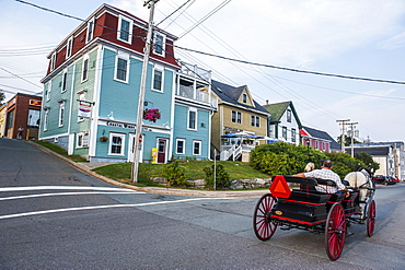 Horse cart riding historical style in the Old Town, Lunenburg, UNESCO World Heritage Site, Nova Scotia, Canada, North America