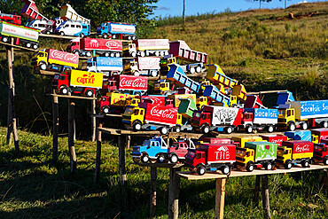 Replica trucks and lorries for sale at a roadside stall on the RN7 near Antsirabe, Central Madagascar, Africa