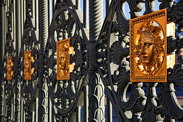 The royal gates of the Royal Palace of Turin (Palazzo Reale) embossed with a golden Medusa symbol to fend off intruders, Turin, Piedmont, Italy, Europe 