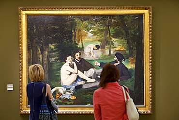 Visitors enjoying Le Dejeuner sur L'Herbe by Manet, Musee d'Orsay, Paris, France, Europe