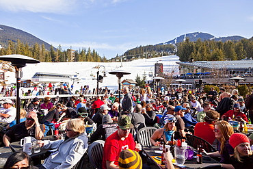 Visitors enjoying apres ski at an outdoor patio, Whistler Blackcomb Ski Resort, Whistler, British Columbia, Canada, North America