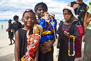 Boys, with soot smeared on their faces, in the parade along White Beach during the Ati-Atihan Festival, an annual feast in honour of the Santo Nino, Boracay, Aklan, Philippines, Southeast Asia, Asia