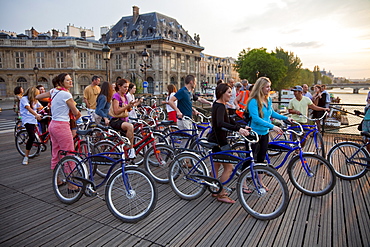 Visitors touring the city by bicycle, Paris, France, Europe