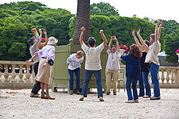 Laughter yoga session, Jardin du Luxembourg, Paris, France, Europe