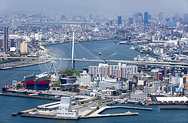 Central Osaka City behind the Tempozan Bridge which crosses over the Aji River at Osaka Bay, Osaka, Japan