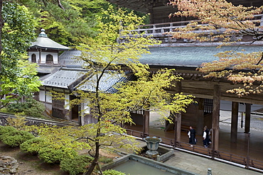 Monks inside main Sanmon Gate at Eiheiji Temple, headquarters of the Soto sect of Zen Buddhism, Fukui, Japan