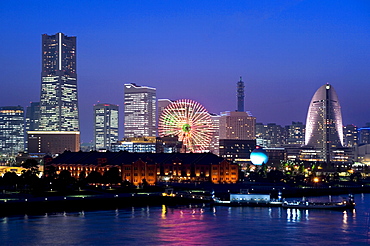 Twilight view of Red Brick Park and Landmark Tower at MM21 waterfront complex, Yokohama, Japan, Asia