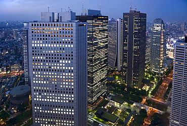 Evening skyline view of skyscraper high-rise corporate buildings in Nishi Shinjuku (West Shinjuku), Tokyo, Japan, Asia