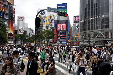 Shibuya crossing in front of the Shibuya train station is one of Tokyo's busiest city centers, Tokyo, Japan, Asia