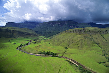 Aerial image of tepuis showing south side of Auyantepui (Auyantepuy) (Devil's Mountain) from Uruyen valley, Canaima National Park, UNESCO World Heritage Site, Venezuela, South America