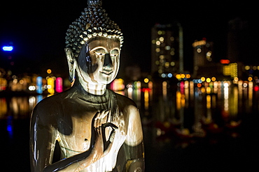 A statue of Buddha at Vesak, a festival to celebrate Buddha's birthday in Gangaramaya Temple, Colombo, Sri Lanka, Asia 