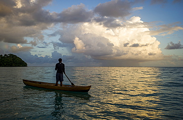 A man in a dug out canoe, Solomon Islands, Pacific 