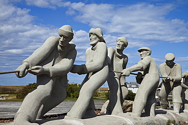 Sculpture of fishermen on island in the Gulf of St. Lawrence, Iles de la Madeleine (Magdalen Islands), Quebec, Canada, North America