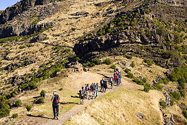 Walkers stride out on a marked footpath on the Pico Ruivo on the island of Madeira, Portugal, Europe