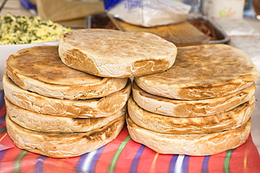 Traditional Madeiran flat bread is cooked and served at a stall in Funchal, Madeira, Portugal, Europe